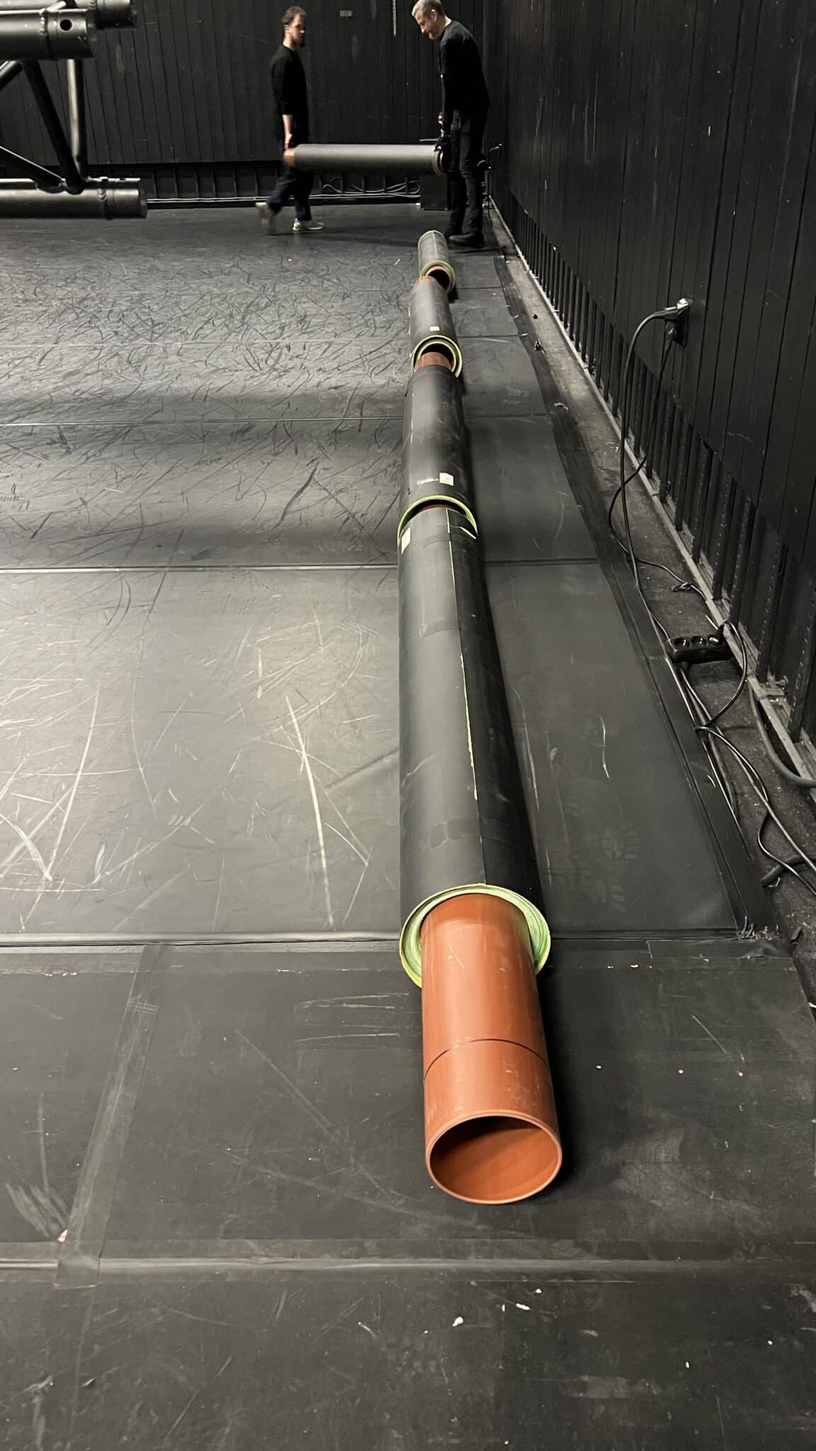 Rolls of the painted floor arranged in Studio Bergen, ready for set-up. Ruller av det malte gulvet lagt klart i Studio Bergen, klare for montering.